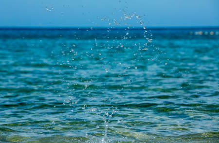 Water splashing with Ocean wave backgroundの写真素材