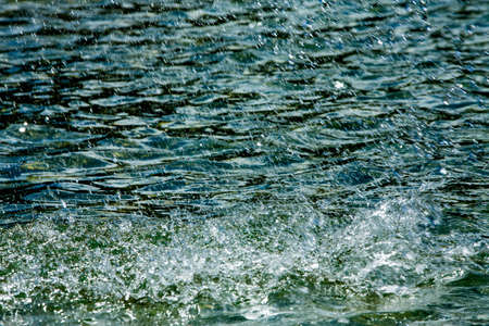 Water splashing with Ocean wave backgroundの写真素材