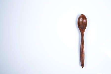 Wooden spoon isolated on a white backgroundの写真素材