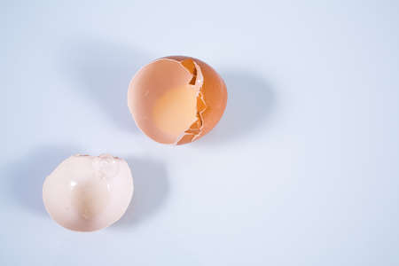 Cracked egg shells isolated on white backgroundの写真素材