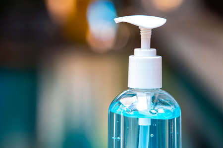 People's hands using wash hand sanitizer gel pump dispenser with alcohol gel sanitizer on white, Close up&Macro shot, Select focus, Prevention from covid19, Bacteria, Healthcare, 7 step wash handの写真素材