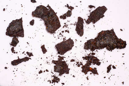 Pieces of Rusty metal texture on white acrylic, Abstract background, Close up shot, Selective focus, Industry conceptの写真素材