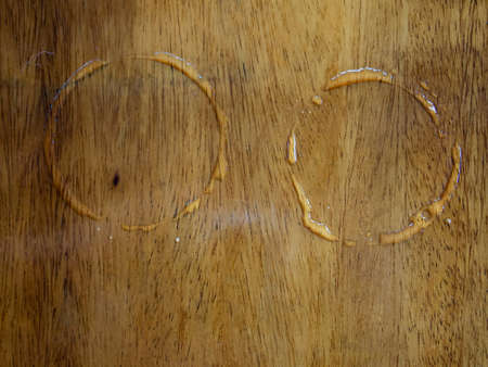 2 Trace water from cups on wood texture, Abstract background, sign concept, Close up and macro shotの写真素材