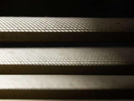 Dust blinds inside a window, Dust and Dirty mosquito wire screen window, Light & Shadow shot, Close up and macro shot, Selective focusの写真素材