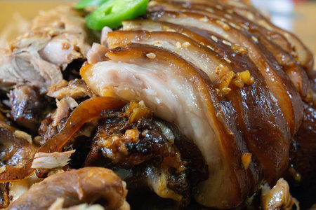 Braised pork shanks with soy sauce on dishの写真素材