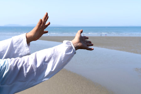 swaying hands in the background of sea. Idyllic seascape.の写真素材