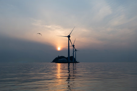 An image of wind turbines in the sea at sunset. Alternative energy sourceの写真素材