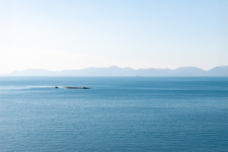 Seascape with blue sea and mountains in the background. Beautiful seascape.の写真素材