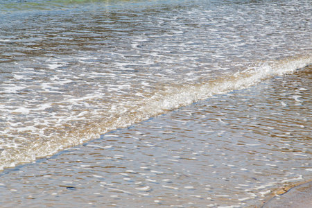 Close up of sea waves on the beach in summer. Seascape