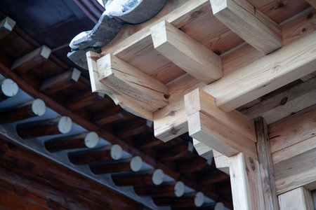 Korean traditional style wooden house, close-up view of the roof.