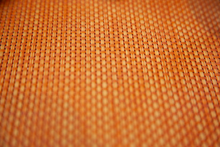 Close-up of an orange wicker mat. Background and texture.の写真素材