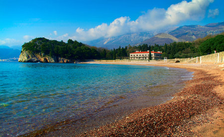 Beautiful crystal clear sea with black pebble beach at Montenegro.のeditorial素材