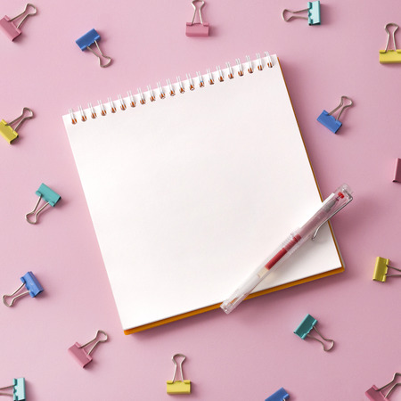 Flat lay picture with blank open notepad and different accessories on colored surface.の写真素材