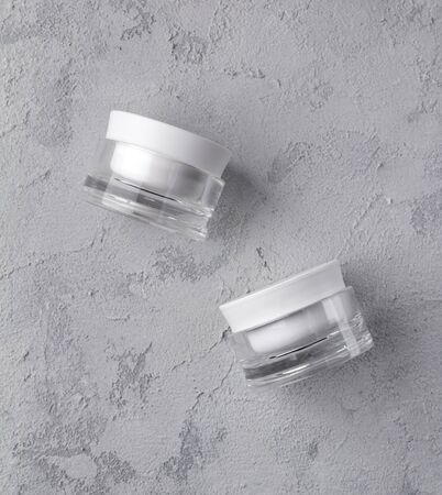 Two cosmetic jar containers flat lay. Blank label for branding mockup. Natural beauty product conceptの写真素材