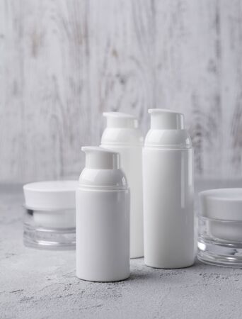 Set of cosmetic cream bottles on gray background. Beauty and skin care conceptの写真素材