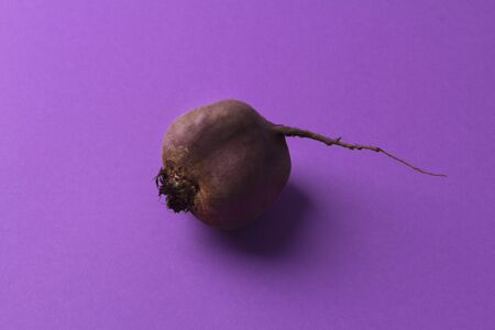 Fresh organic beetroot on violet background. Overhead view, copy spaceの写真素材