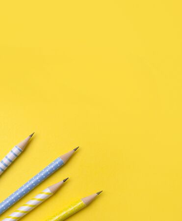 School office supplies at yellow background with copy space. Flat lay back to school concept.の写真素材