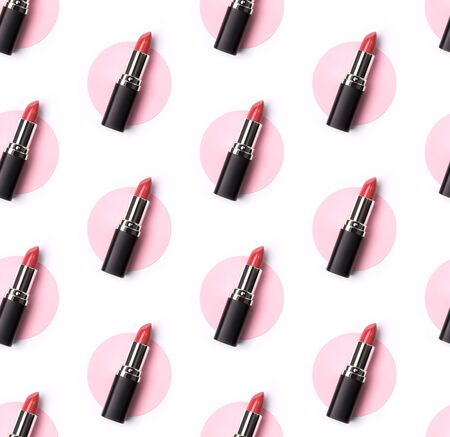 Pink lipstick seamless pattern on creative pastel pink and white background. Professional makeup product conceptの写真素材