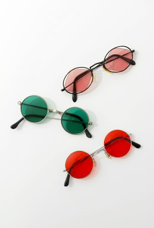 Vintage fashionable set of round sunglasses on white background. Fashion blogger summer beach conceptの写真素材