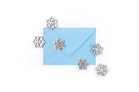 Blue envelope with snowflakes isolated on white background. Creative winter composition.Template...