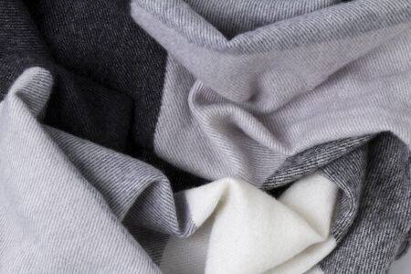 Texture of knitted gray fabric close up. Wool knitwear. Winter autumn scarf designの写真素材