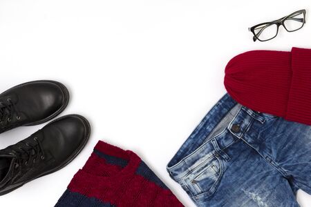 Flat lay top view female casual style look with warm sweater, jeans, boots, hat and glasses. Women fashion cloth and accessories. Fashion blog conceptの写真素材