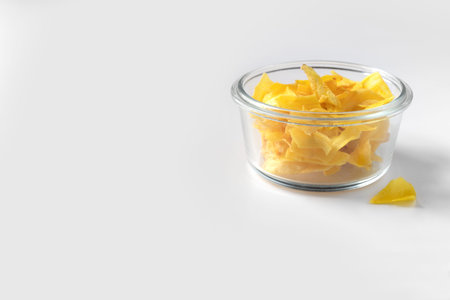 Organic jackfruit chips on paper background with copy space