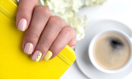 Woman's hands with spring summer nail design. Fashionable trendy female manicure in minimal style. Beauty salon templateの写真素材