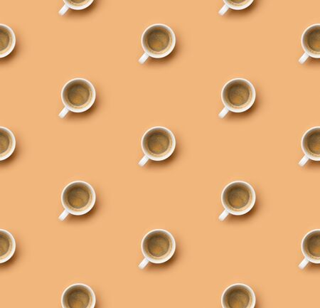 Coffee pattern with white espresso cup on beige. Pop art minimal flat lay creative composition. Morning breakfast backgroundの写真素材