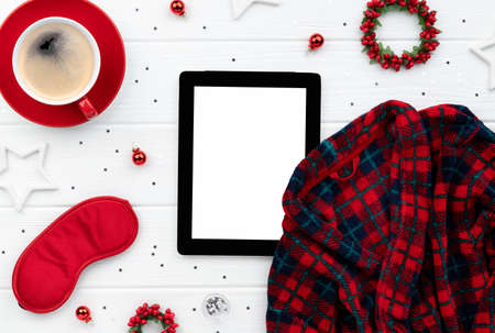 Christmas shopping sale mockup with robe, coffee and ornaments on wooden background. Top view flat lay template for greeting invitationの写真素材