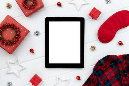 Christmas shopping sale mockup with robe, gifts and ornaments on wooden background. Top view flat lay template for greeting invitationの写真素材