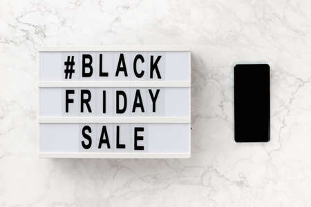 Creative top view flat lay promotion composition with Black friday sale text on lightbox. Template banner online shopping sale mockupの写真素材