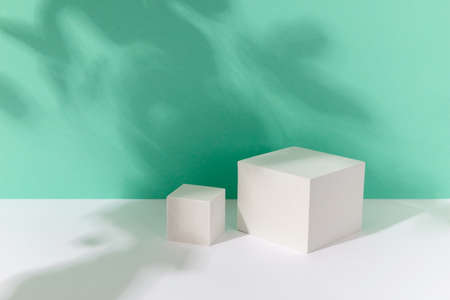 Abstract background mock up with podium for product display with shadows on turquoise. Blank product stand in minimal slyle.の写真素材