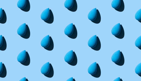 Seamless pattern with cosmetic sponge on blue background. Beauty salon blogger banner template.の写真素材