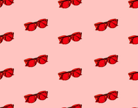 Seamless pattern with trendy modern red sunglasses on pink backgroundの写真素材