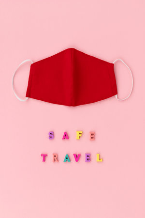 Non-medical face covering mask and inscription safe travelの写真素材