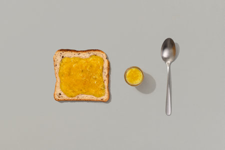Toast with lemon jam on gray backgroundの写真素材