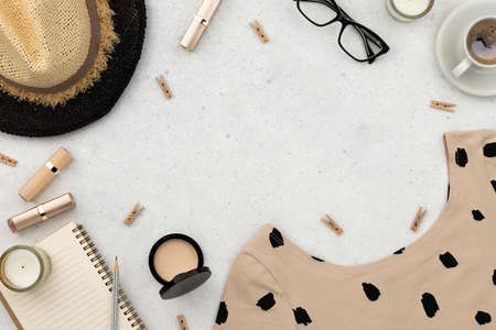 Womens summer clothes, cosmetics and accessories on gray backgroundの写真素材