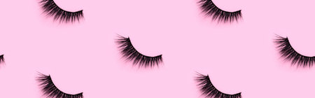 Pattern with eyelashes on pink background. Flat lay top view