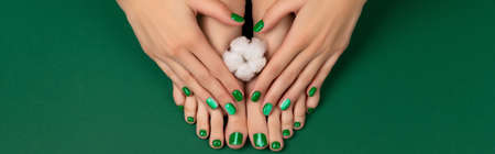 Manicure, pedicure beauty salon concept. Womans feet with cotton flowerの写真素材