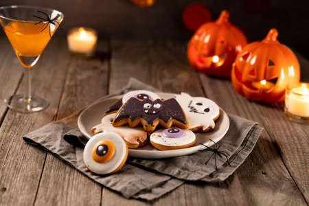 Halloween homemade dessert on rustic wooden table.の写真素材