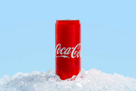 Kyiv, Ukraine - November 13, 2021. Coca cola can in crushed ice. Soft drink refreshment conceptのeditorial素材
