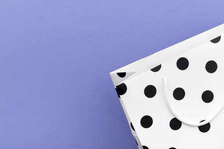 Paper bag with copy space on purple background.の写真素材