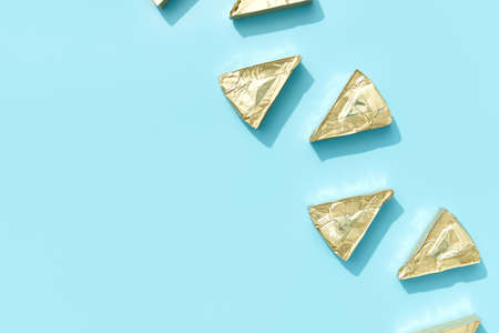 Pattern with processed cheese on blue background. Minimal creative food conceptの写真素材