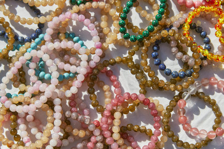 Stone bracelets on street market stall. Traditional portuguese souvenir. Local business