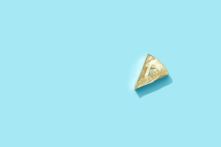 Processed cheese on blue background with deep long shadows. Minimal creative food concept