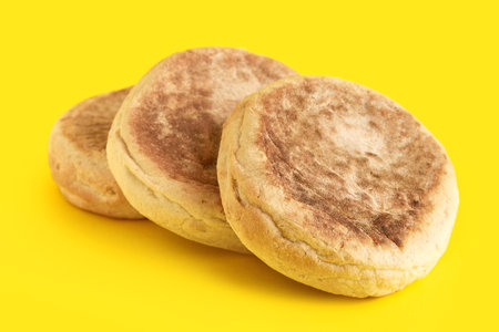 Bolo de caco. Traditional portuguese bread on yellow backgroundの写真素材