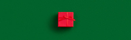 Christmas celebration concept. Gift on green backgroundの写真素材