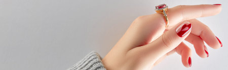 Manicured womans hand in sweater. Manicure, pedicure design trends