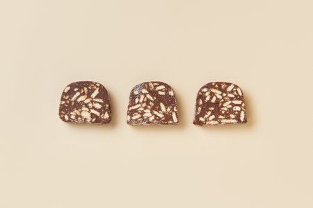 Traditional portuguese dessert Salame de Chocolate on beige background in minimal style. Restaurant bakery menuの写真素材